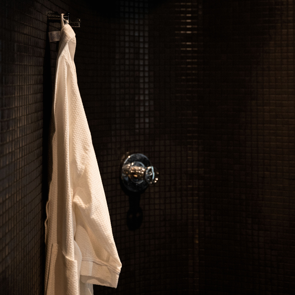 steam room towel hanging on tile wall